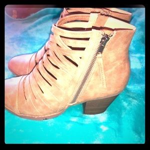 Nude colored strappy boots